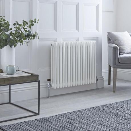 Milano Windsor column radiator in a white livingroom.
