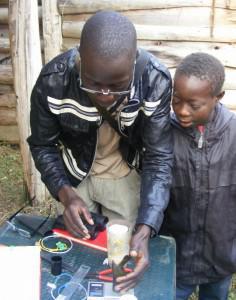 Amos watches Nathan identify the latest bird catch