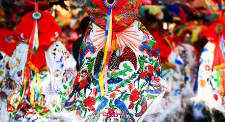 Enchanting Travels Mexico Tours Horizontal photo of a Carnival scene, dancers wearing a traditional mexican folk with an amazing cape rich in color