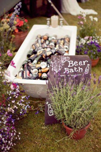 rustic wedding ideas beer bath decorated with wildflowers paula o'hara photography