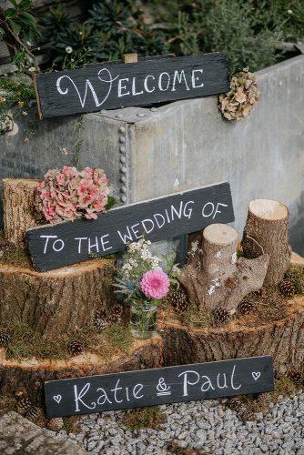 rustic wedding ideas tree stump decor ideas with flowers and signs nick walker photography