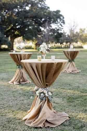 rustic wedding ideas tall round table with burlap tablecloth and flowers elyse jennings weddings