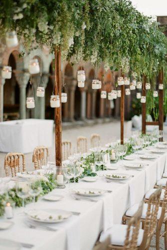 rustic wedding ideas outdoor reception table with suspended candles in jars greg finck