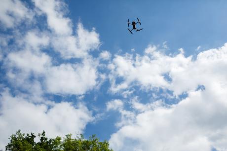 Summer Solstice Wedding – Polly and Steve a drone taking photos of the wedding guests