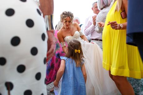 Summer Solstice Wedding – Polly and Steve polly dances with a young guest