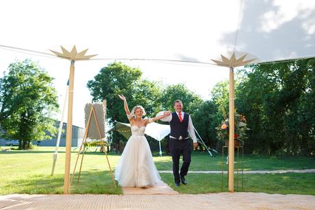 Summer Solstice Wedding – Polly and Steve bride and groom enter the marquee