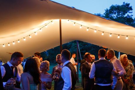 Summer Solstice Wedding – Polly and Steve guests enjoy drinks outside