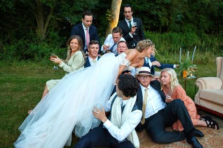 Summer Solstice Wedding – Polly and Steve the bride dives onto a group of guests