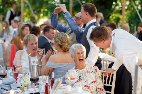 Summer Solstice Wedding – Polly and Steve a laughing wedding guest