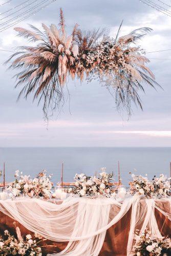 wedding ideas elegant pink beach wedding with dry boho hanging flower and grass sweetbellaproject
