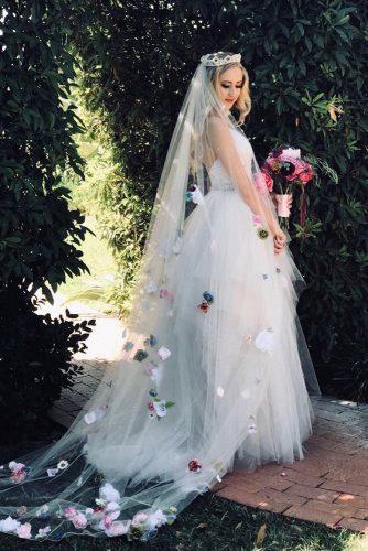 wedding trends 2020 long white bridal veil with trains and bright flowers long blonde hair down silver tiara inventingvintage