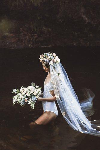 wedding trends 2020 bridal photo session in the river white lace bodysuit veil with flower crown cascading bouquet lara hotz photography