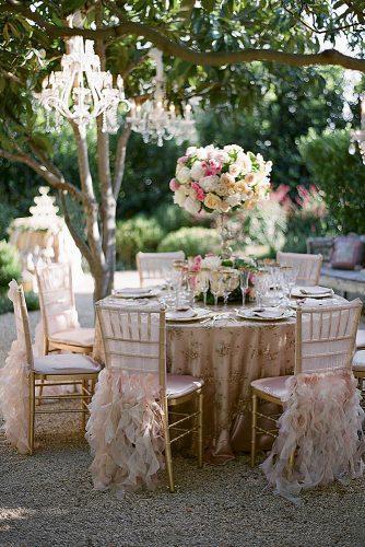 shabby chic vintage wedding decor ideas outdoor reception in rose colors decrated with flowers michael costa photographers