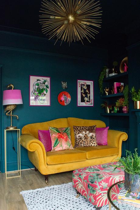 Mustard velvet sofa paired with Serpentine paint by Zoffany. Colourful prints , quirky accessories and patterned cushions all by Audenza.