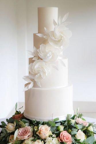 wedding cake ideas photos gallery Simple minimalistic tall white cake with white rose and leaves hayleyelizabethcakedesign
