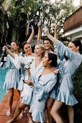 happy bridesmaids bride and bridesmaids drinking champagne