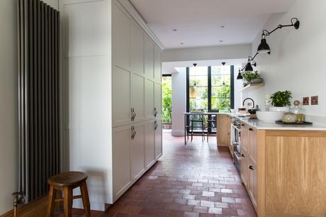 white kitchen with vertical radiator