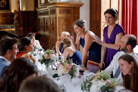 wedding guests chat at a cambridge college wedding