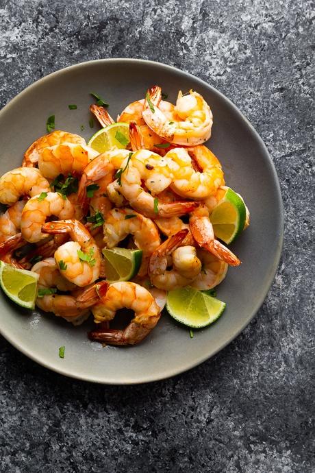 overhead view of air fryer shrimp on gray plate