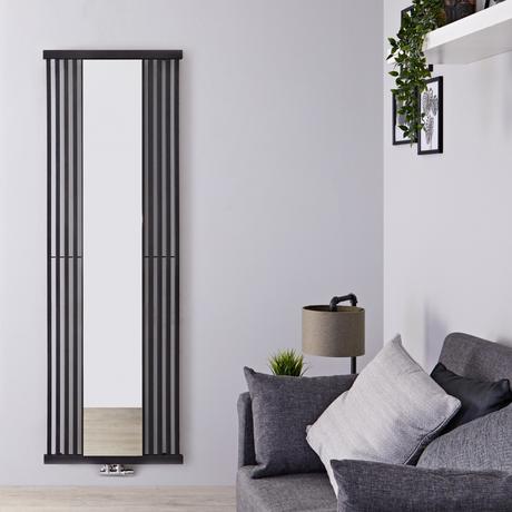 Terma Intra vertical radiator on a gray wall in a living room