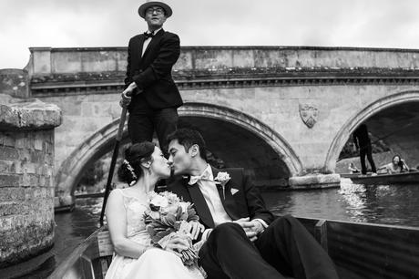 bride and groom go punting in cambridge