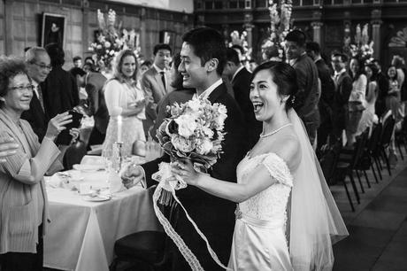 bride and groom in the trinity college dining hall