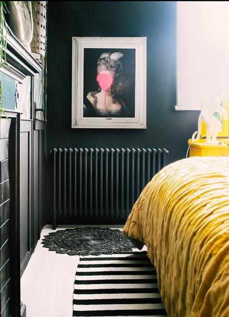 Milano Windsor column radiator on a dark bedroom wall