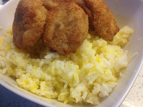 Salted egg rice topped with chicken nuggets