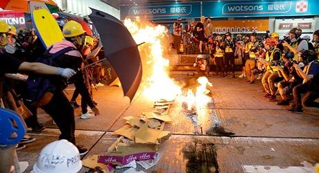 Hong Kong protests turn violent after Chinese flag tossed into iconic harbour