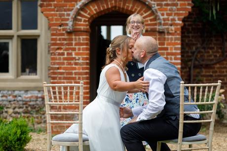 Hautbois Hall Wedding Photos – Eleanor and Matthew first kiss at a hautbois hall wedding