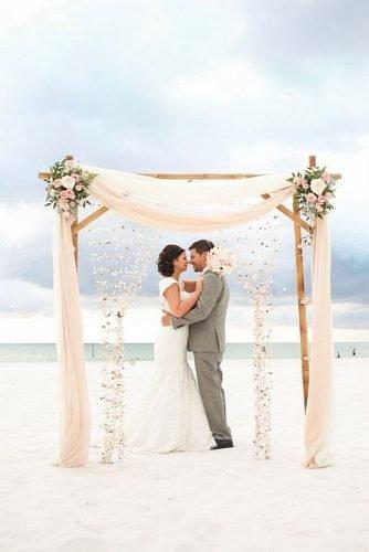 wedding arch seashore arch bamboo with flowers seashells