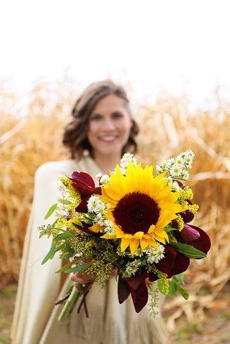 sunflower wedding bouquets with maroon leaves