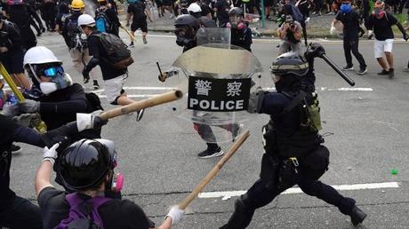 Hong Kong police draw guns, arrest 36 in latest protest