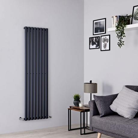 Milano Aruba vertical anthracite radiator on a gray wall