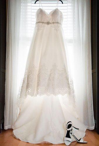 hanging wedding dress dress and shoes doublemphotophoto