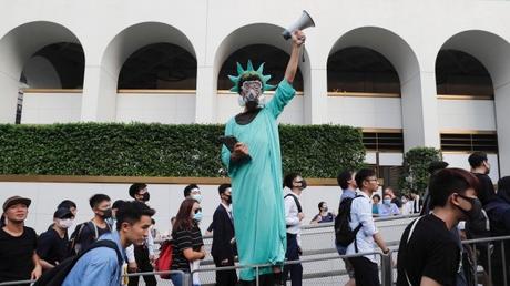 Marchers ask Trump to 'liberate' Hong Kong, as clashes erupt