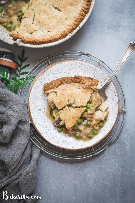 This Vegan Pot Pie has a scrumptious flaky gluten-free & paleo crust and the creamy filling is absolutely loaded with vegetables! This hearty, filling meal is perfect for chilly days and freezes well.