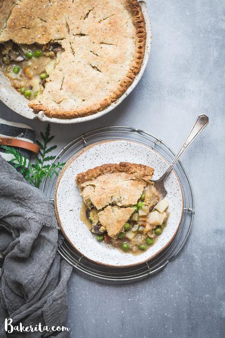 This Vegan Pot Pie has a scrumptious flaky gluten-free & paleo crust and the creamy filling is absolutely loaded with vegetables! This hearty, filling meal is perfect for chilly days and freezes well.