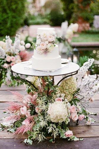 outdoor wedding ideas cake table with floral decor