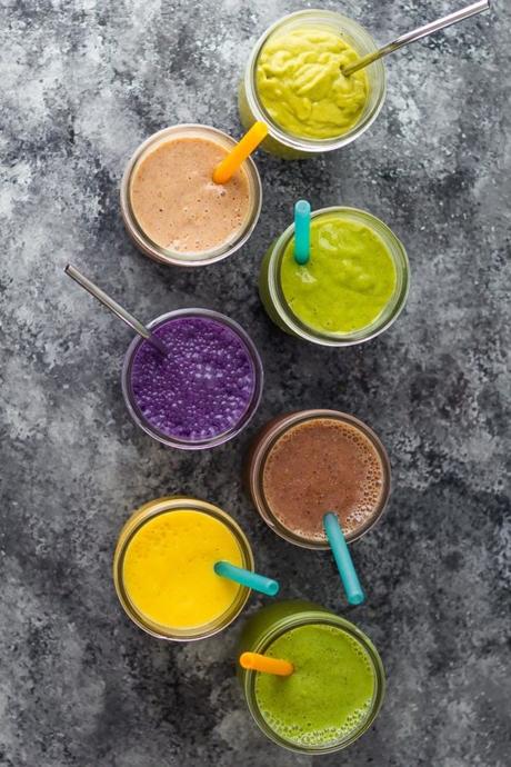 overhead view of 7 rainbow breakfast smoothie recipes