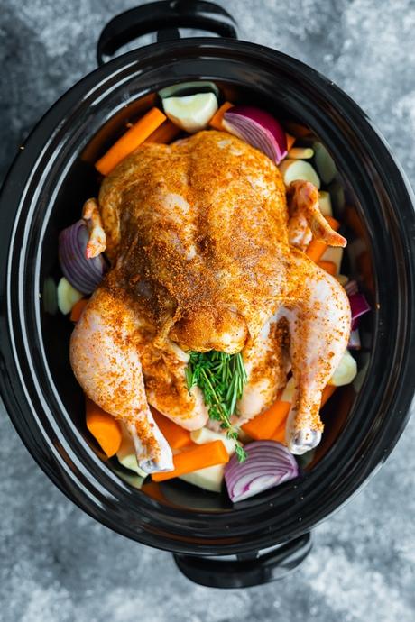 overhead view of crockpot whole chicken in slow cooker before cooking