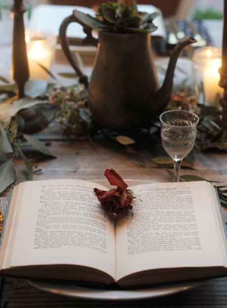 a Halloween tablescape with a mystery book theme a Halloween tablescape with a mystery book theme