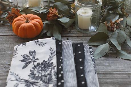 a Halloween tablescape with a mystery book theme a Halloween tablescape with a mystery book theme