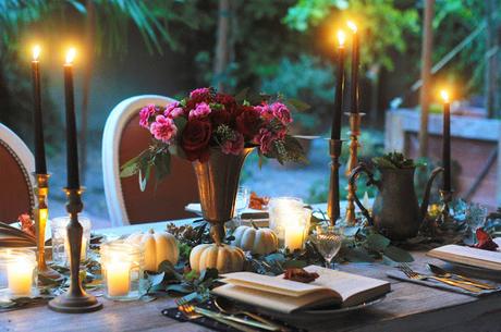 a Halloween tablescape with a mystery book theme a Halloween tablescape with a mystery book theme