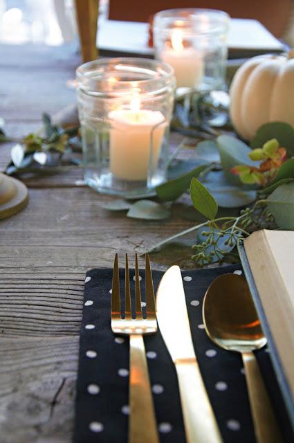 a Halloween tablescape with a mystery book theme a Halloween tablescape with a mystery book theme