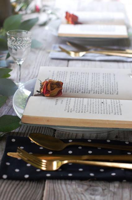 a Halloween tablescape with a mystery book theme a Halloween tablescape with a mystery book theme