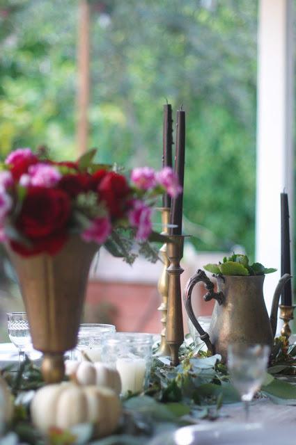 a Halloween tablescape with a mystery book theme a Halloween tablescape with a mystery book theme