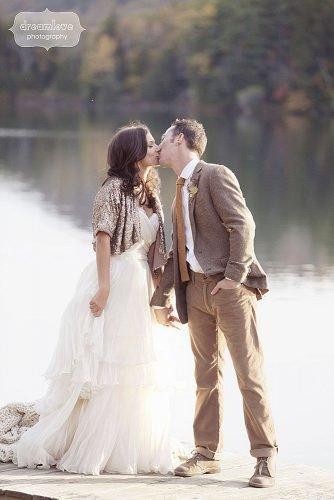 fall wedding party glittery wedding jacket bride and groom kissin