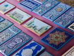 Hard carved and painted wooden being sold at the Bibi-Khanym Mosque