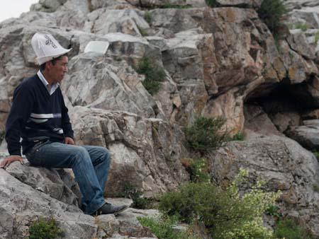 Kyrgyz man wearing traditional Kyrgyz white felt hat